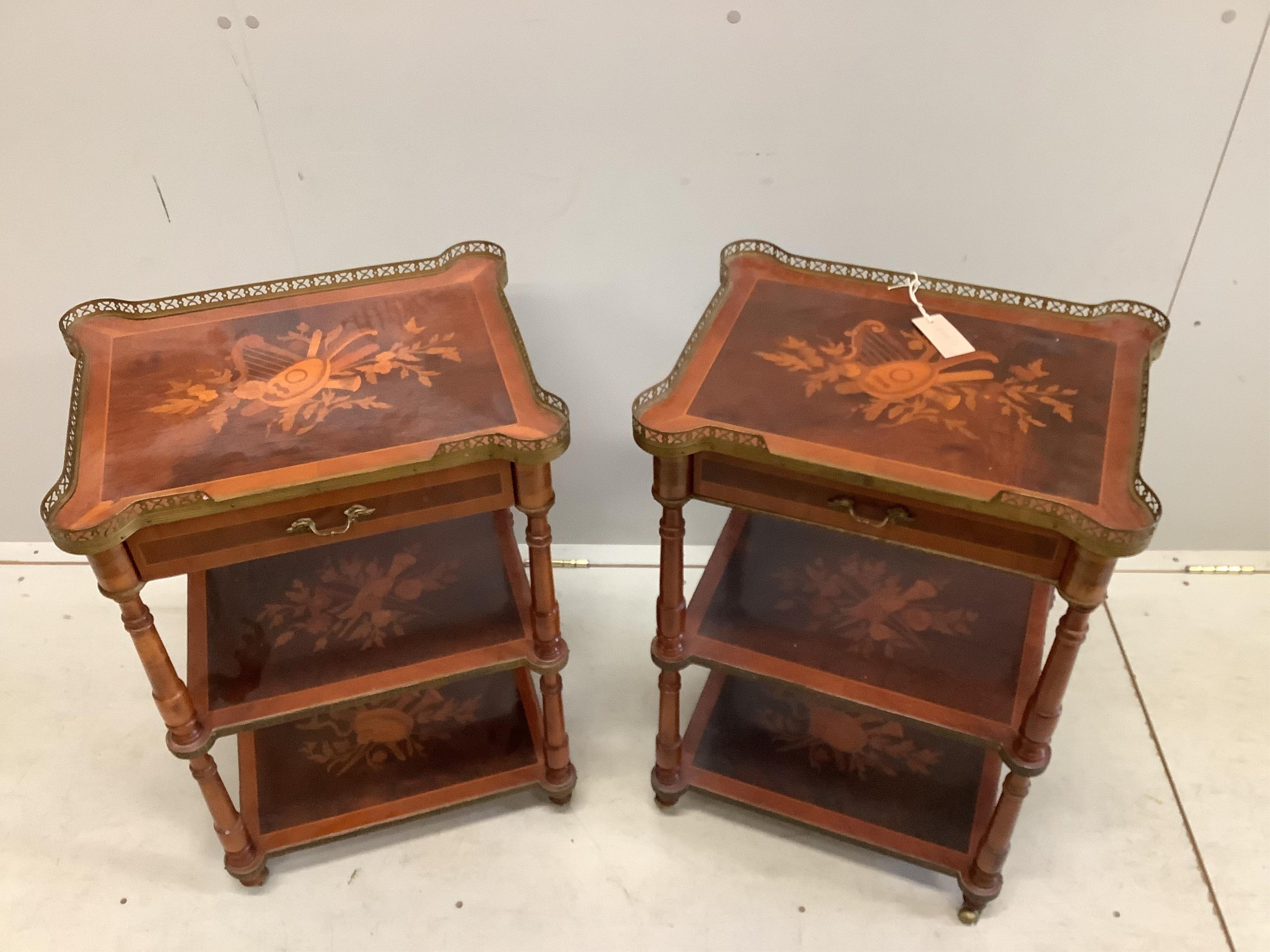 A pair of reproduction marquetry inlaid kingwood three tier tables, width 48cm, depth 37cm, height 71cm. Condition - fair to good